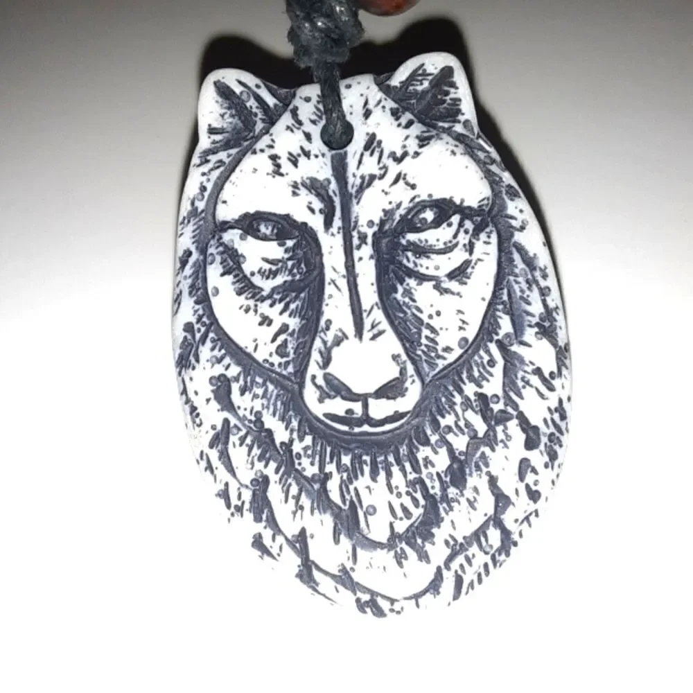 Hand CRAFTED UNISEX wolf charm with adjustable necklace